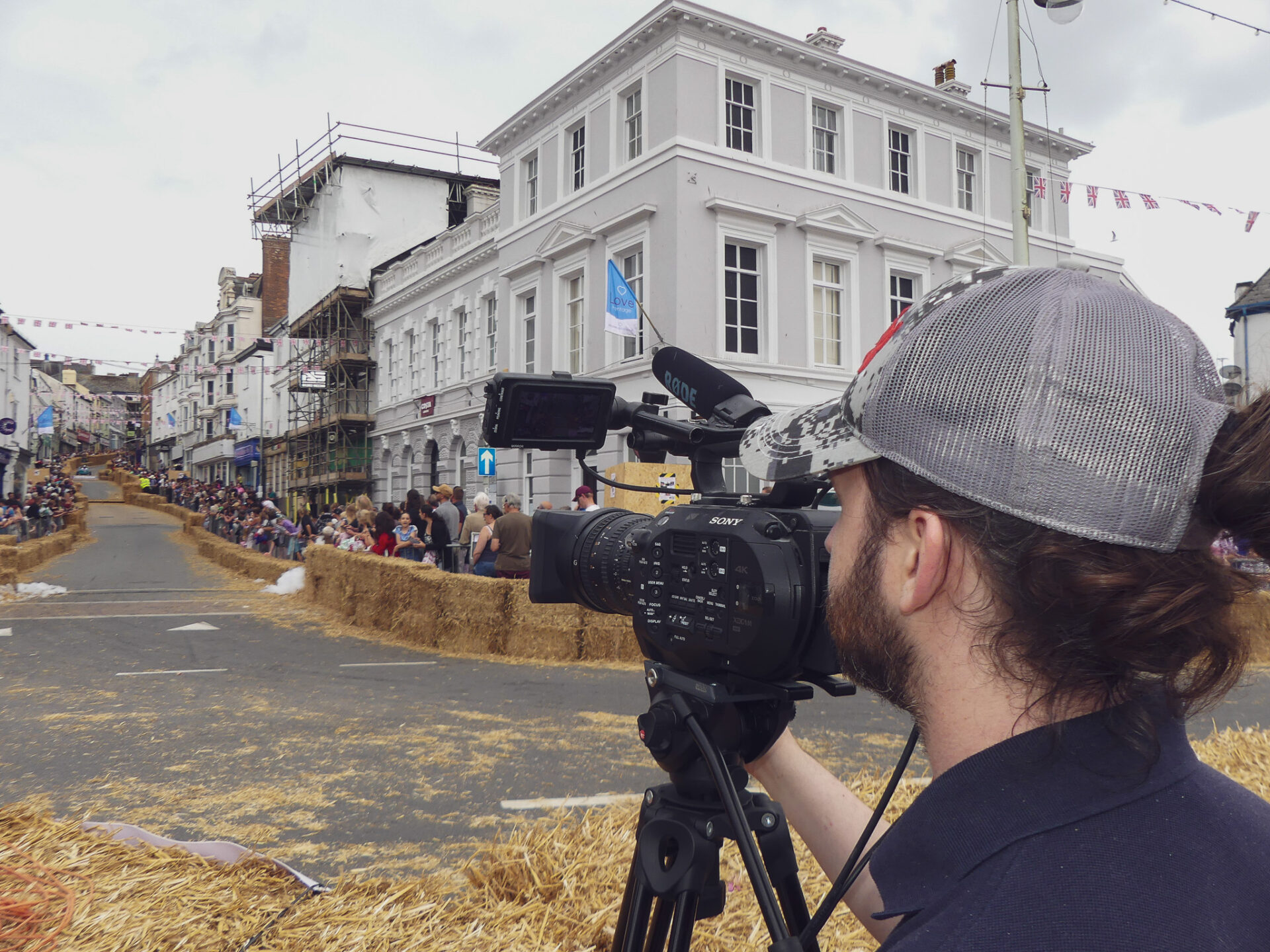 Jake at soapbox Camera person behind a camera looking up the road