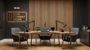 A podcast studio with three chairs, a table, microphones and sound proofed walls